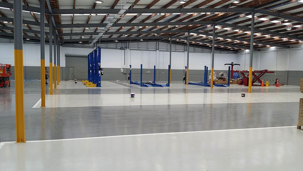 Industrial Flooring + Resin Coatings | Solid Floors | How Concrete Grinding & Polishing Improves Industrial Flooring Performance Industrial Flooring